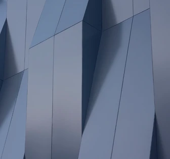The image shows an abstract architectural structure with sharp, angular shapes and lines in shades of blue and grey, creating a visually striking and geometric design