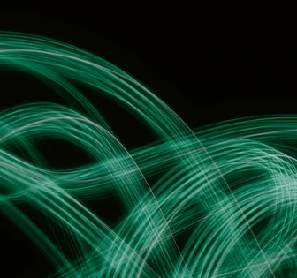 The image displays dynamic, swirling green lines against a dark backdrop, creating a mesmerizing abstract digital pattern