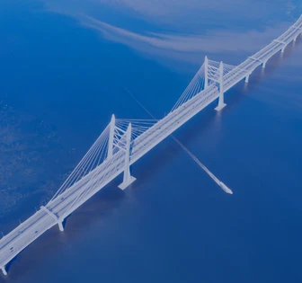 An aerial view of a large suspension bridge with a distinctive architectural design, spanning across a vast body of blue water