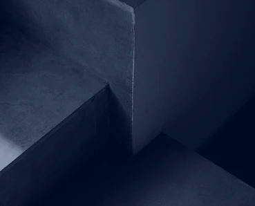 The image depicts a dark, abstract architectural design with sharp angles and contrasting shadows, creating a moody and dynamic visual effect